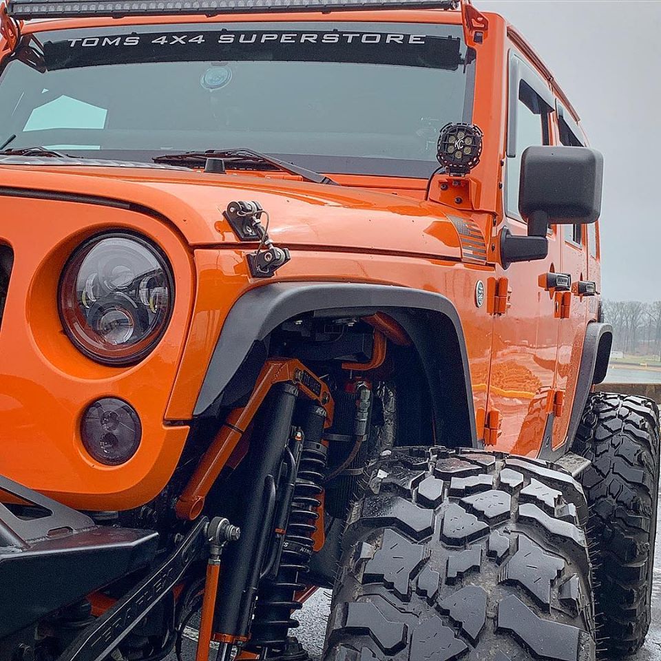 Crusher Front Fender 2" Flare MB1075-2-A for Jeep JK / JKU - Aluminum installed on orange jku with 42" pitbull tires and crusher bumper front up close view
