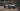 Jeep Gladiator with raw aluminum Motobilt Bobbed Bed, rear three-quarter view