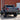 Back view of a lifted truck with with Motobilt Tomahawk high clearence bumper in front of a brick building.