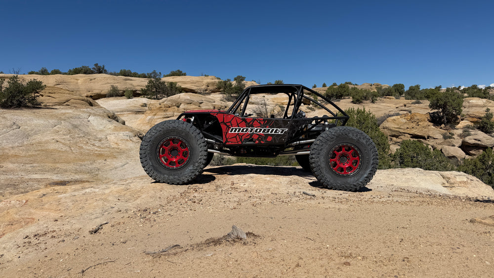 Kingpin, Dan DuBose’s red-and-black Motobilt buggy on the rocks