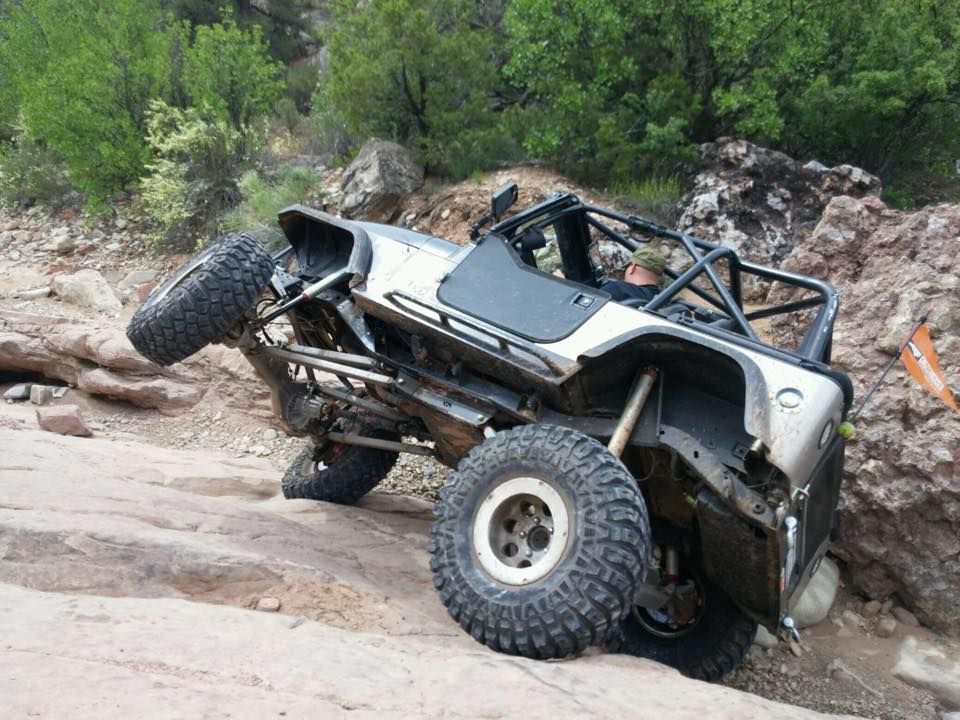 Stretched Jeep YJ using the Motobilt MB1503 4-link suspension on a rock trail